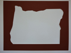 A brown Oregon shaped mat