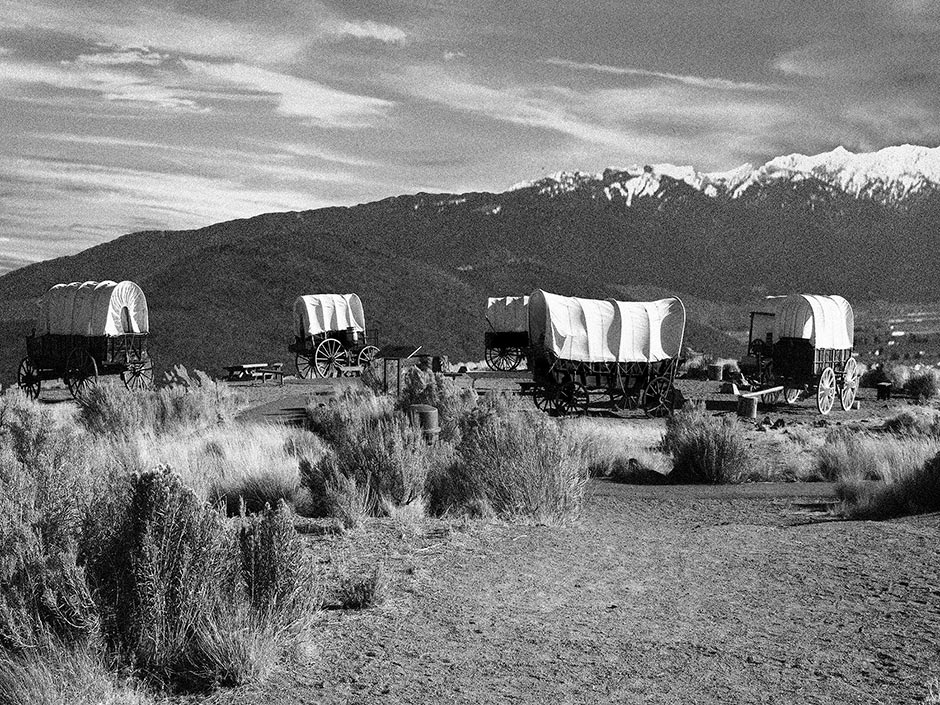 Covered Wagons beneath Elkhorn Ridge BW