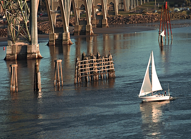 Sailboat by Yaquina Bridge in Newport, Oregon