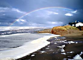 Rainbow over houses in Yachats