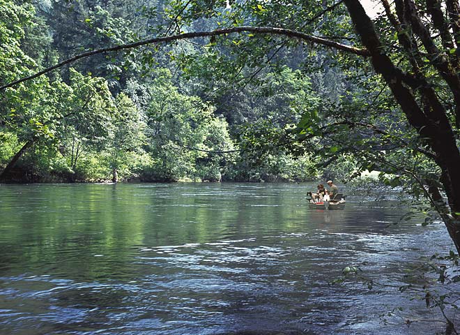 Boaters on McKenzie River with dog in boat; Oregon river pictures sold as framed photo or canvas or digital file