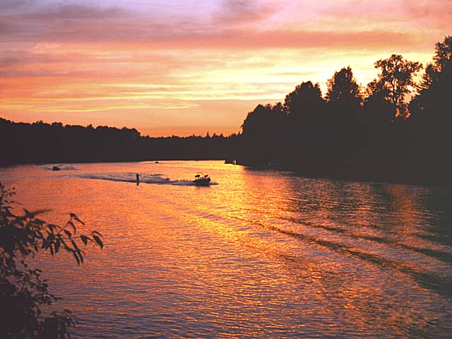 Willamette River colorful evening picture with water skiers; Canby, Oregon river picture available as framed photo or canvas