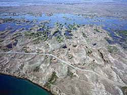 aerial photographs of Central Washington - Irrigation water sinks into the soft Columbia Basin and rises again as potholes to the S of Grand Coulee