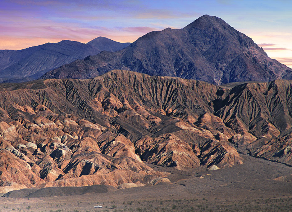 Buy this 1 car driving Past the Funeral Mountains in Death Valley picture