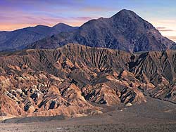 1 car driving Past the Funeral Mountains