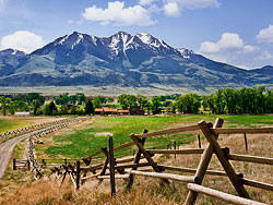 Fence and farm beneath Emigrant Peak - Paradise Valley