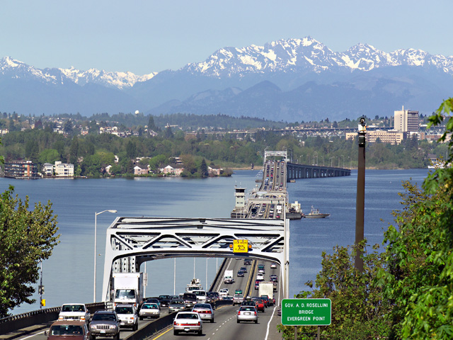 Evergreen Floating Bridge crosses Lake Washington seeing the Olympic Mountains