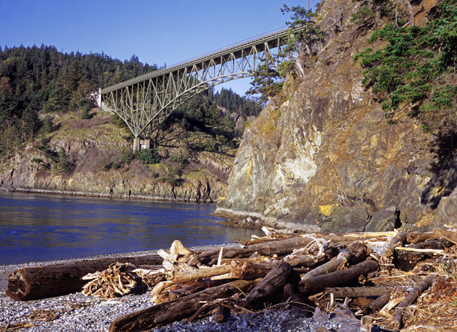 Images of Puget Sound - Driftwood on Whidbey Island beach at Deception Pass; looks at Fidalgo Island